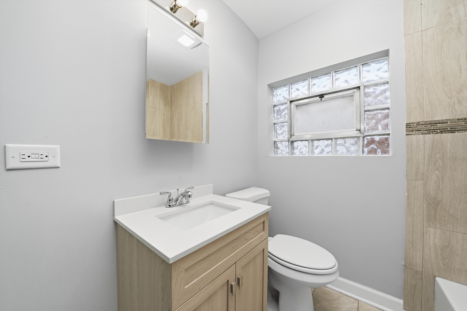 2658 West 83rd Street Chicago, IL 60652 - Photo 14 of 41 a bathroom with a sink toilet and mirror