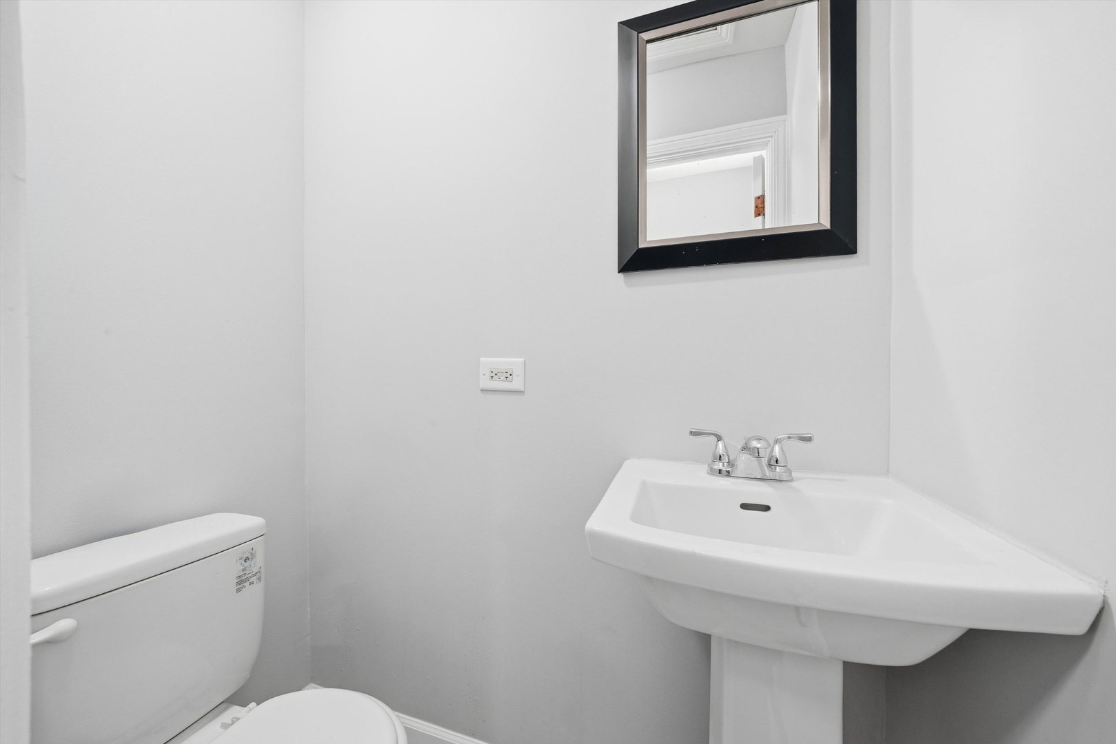 2658 West 83rd Street Chicago, IL 60652 - Photo 17 of 41 a bathroom with a sink a mirror and toilet