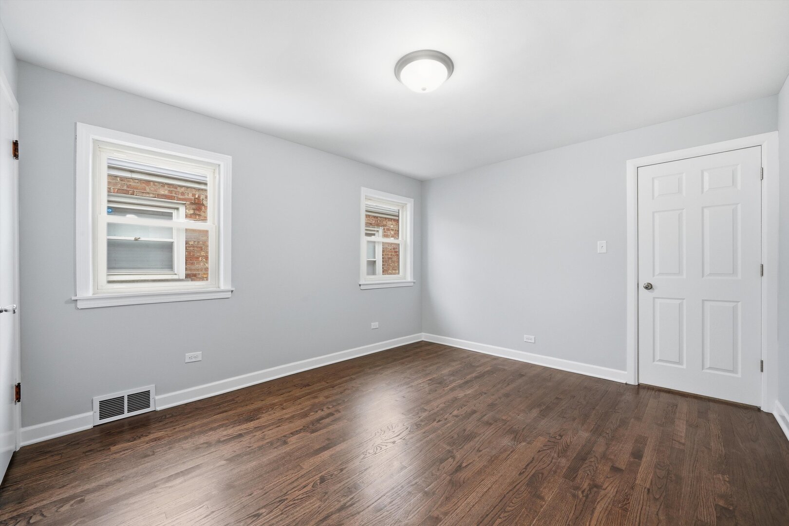 2658 West 83rd Street Chicago, IL 60652 - Photo 19 of 41 a view of an empty room with wooden floor and a window