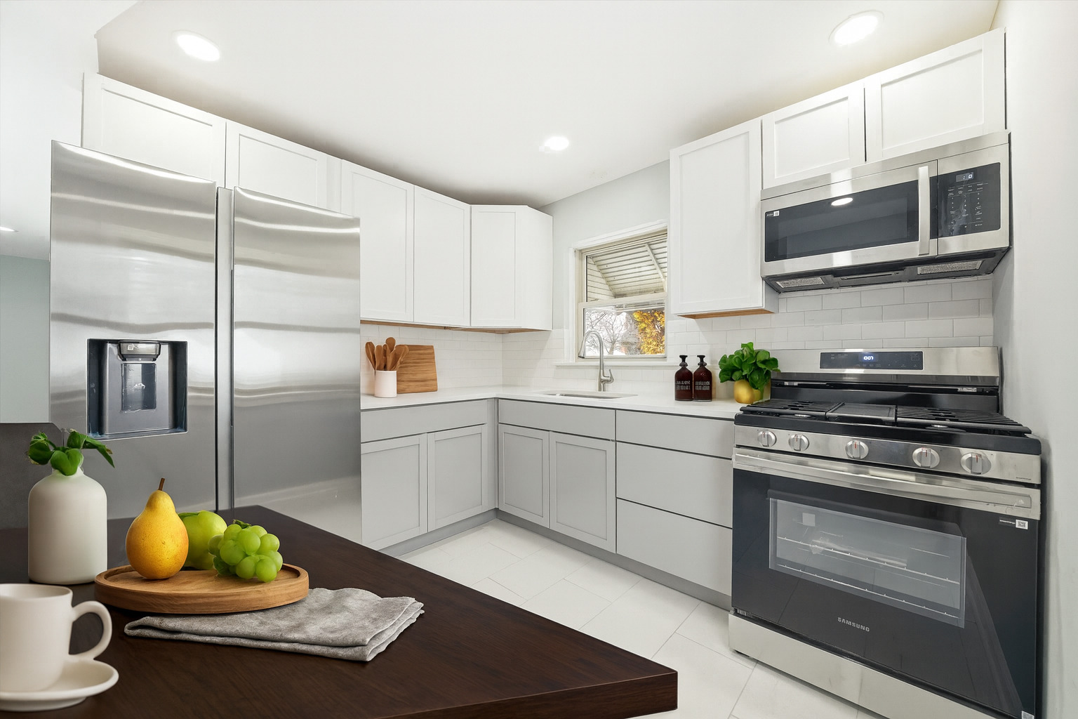 2658 West 83rd Street Chicago, IL 60652 - Photo 10 of 41 a kitchen with a sink stainless steel appliances and cabinets