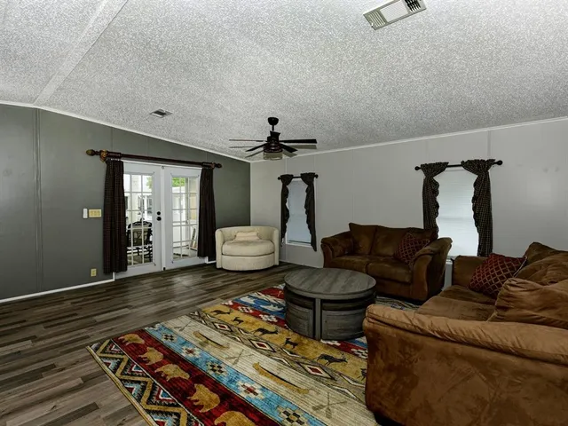 a living room with furniture and a rug