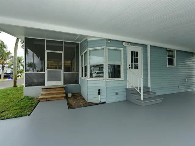 a view of bench in front of house