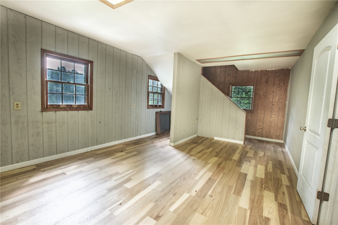 200 Chenault Road Townville, SC 29689 - Photo 33 of 47 Natural wood flooring complements the bright windows of this adaptable bonus room.