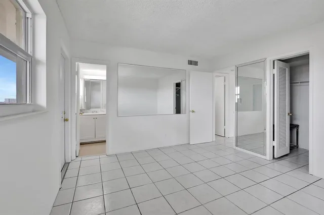 a view of an empty room and window