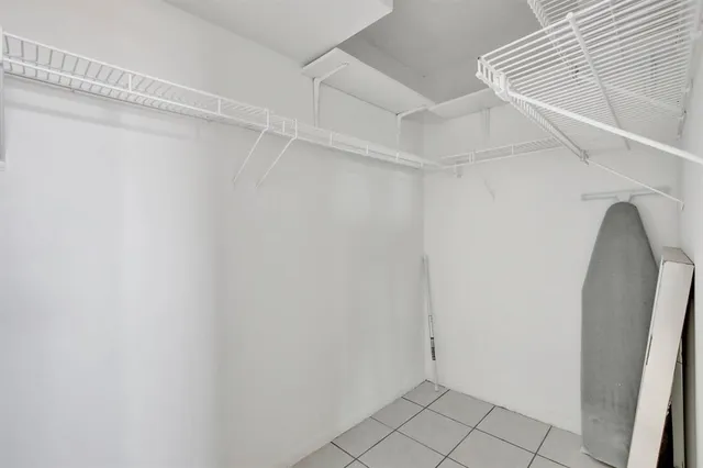 a view of a room with racks on the wall