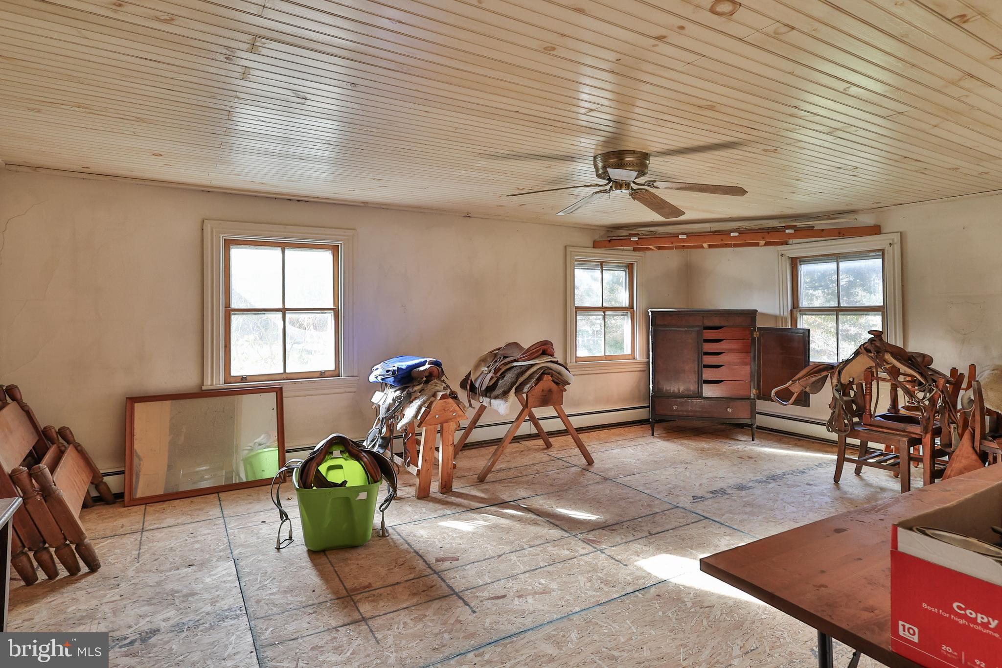 8659 Allemaengel Road Kempton, PA 19529 - Photo 29 of 71 a living room with furniture a window and gym equipment