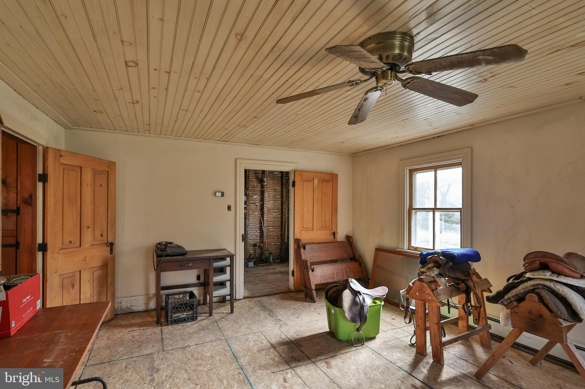 8659 Allemaengel Road Kempton, PA 19529 - Photo 34 of 71 a living room with furniture a ceiling fan a rug and a window