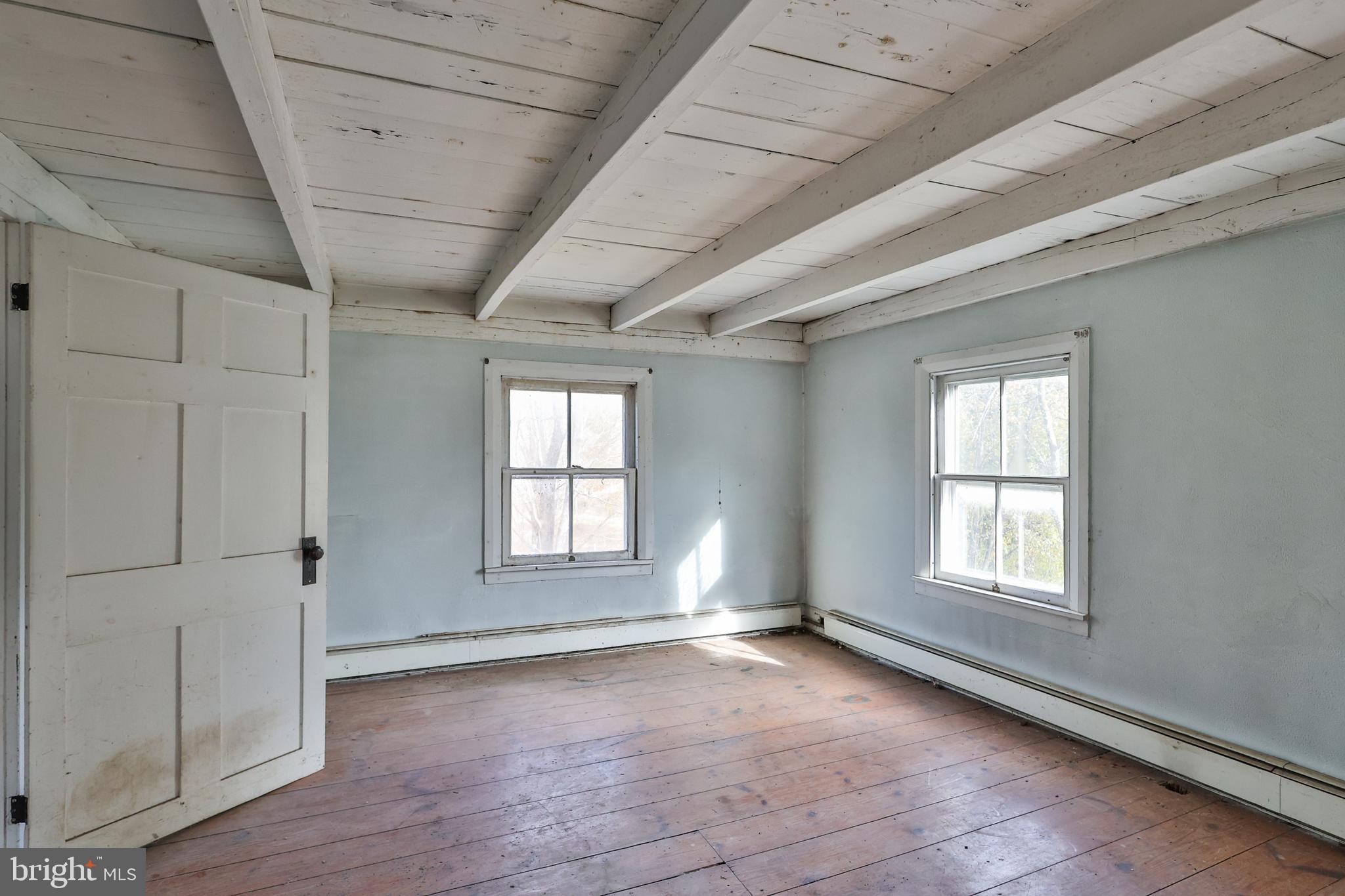 8659 Allemaengel Road Kempton, PA 19529 - Photo 43 of 71 an empty room with wooden floor and windows