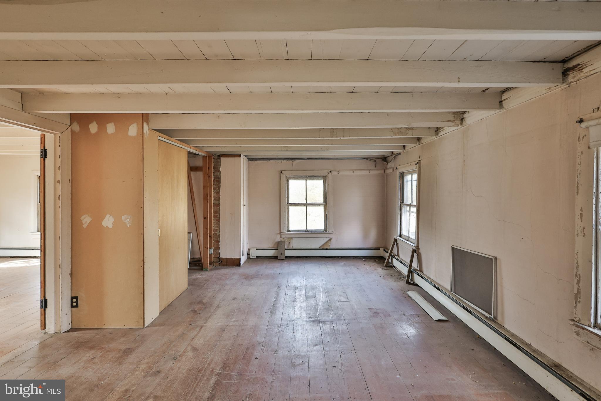 8659 Allemaengel Road Kempton, PA 19529 - Photo 48 of 71 a view of empty room with wooden floor and fan