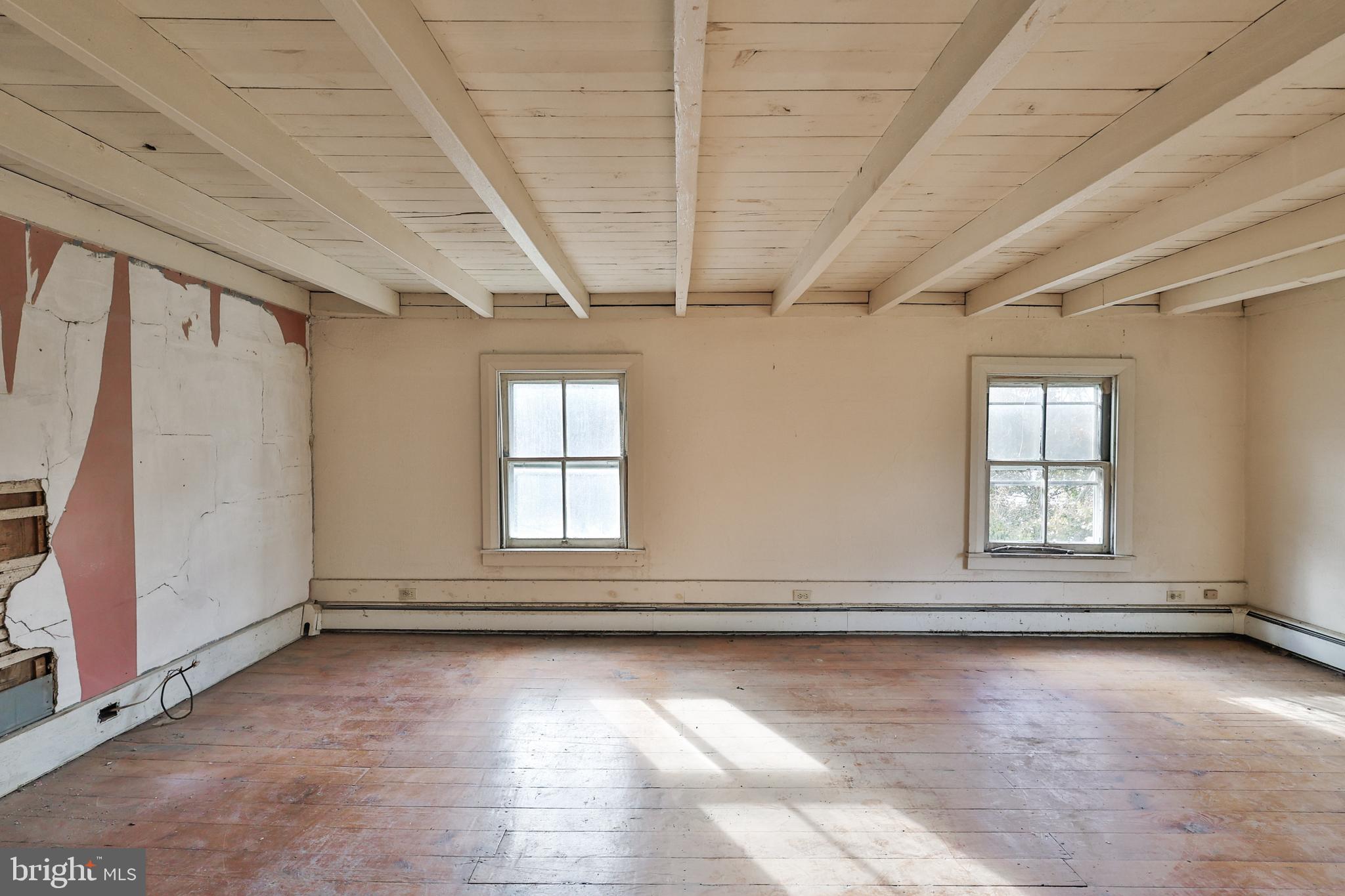 8659 Allemaengel Road Kempton, PA 19529 - Photo 53 of 71 an empty room with wooden floor and windows