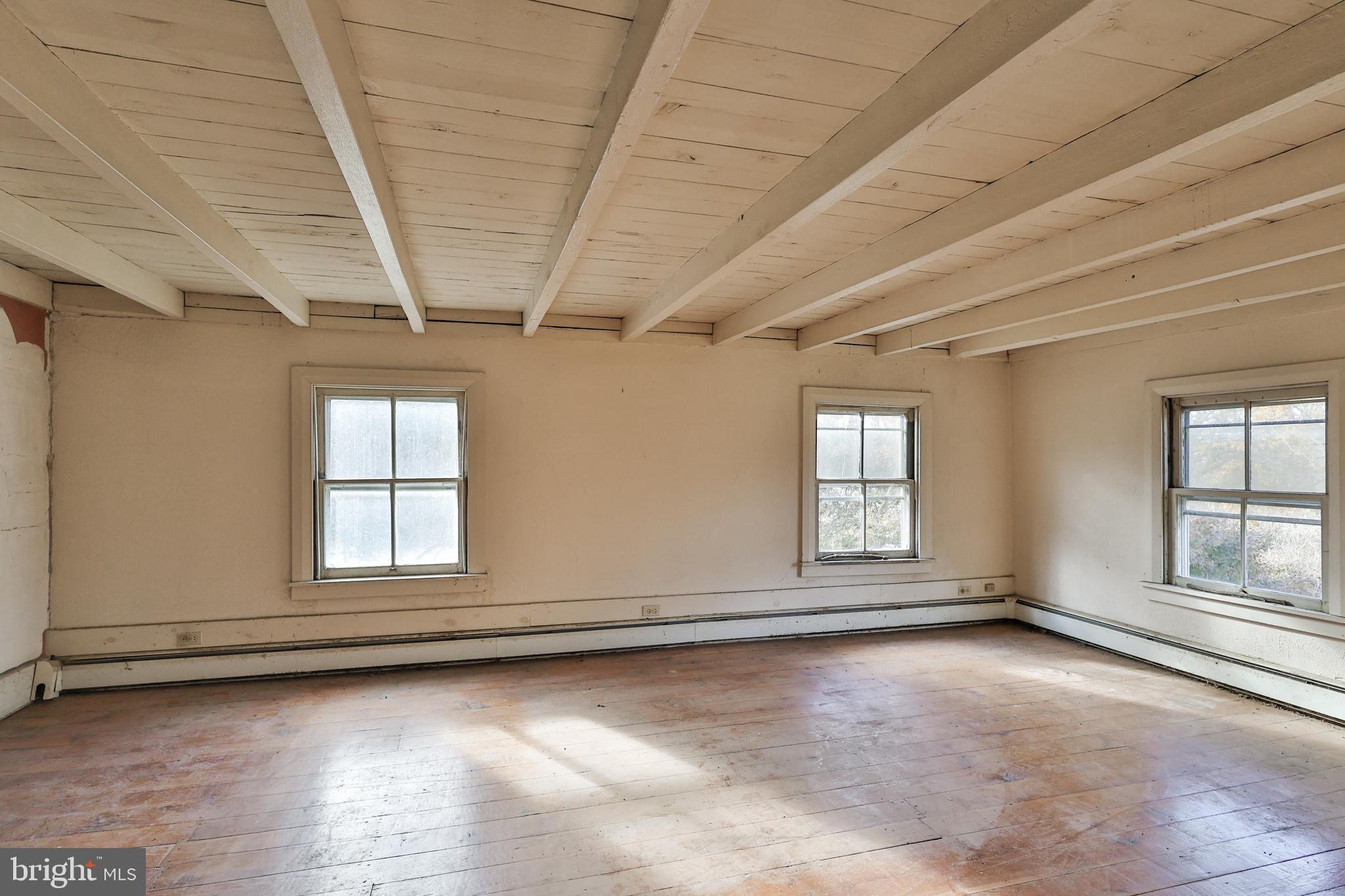 8659 Allemaengel Road Kempton, PA 19529 - Photo 54 of 71 an empty room with wooden floor and windows