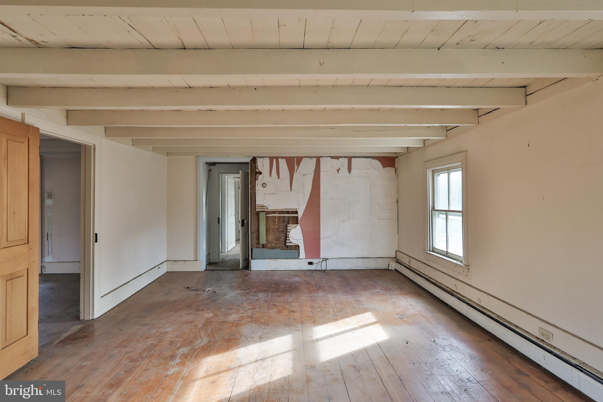 8659 Allemaengel Road Kempton, PA 19529 - Photo 56 of 71 a view of empty room with wooden floor and fan