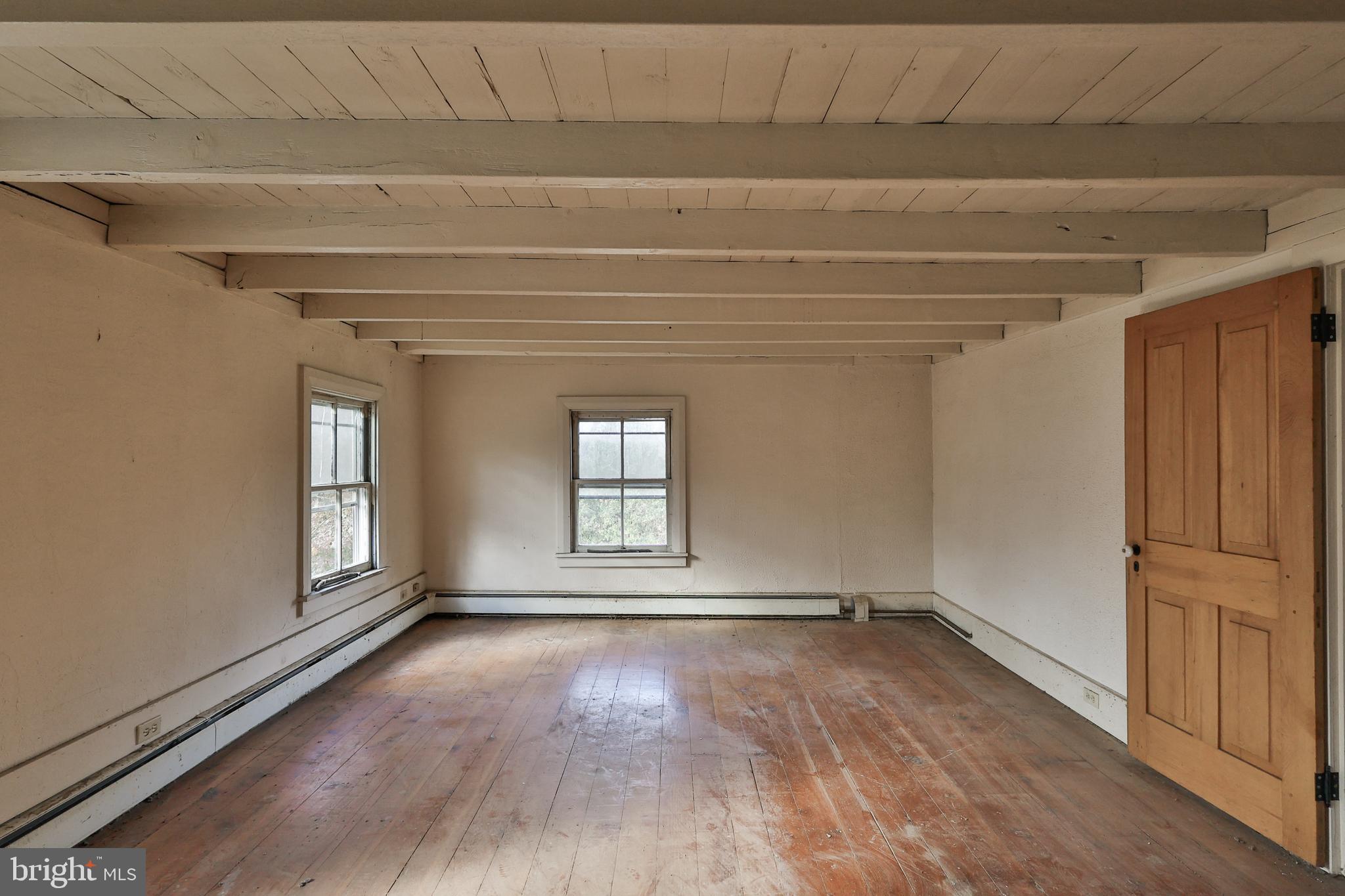 8659 Allemaengel Road Kempton, PA 19529 - Photo 59 of 71 a view of empty room with wooden floor and fan