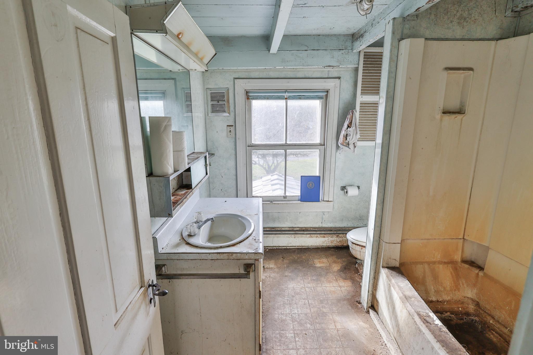 8659 Allemaengel Road Kempton, PA 19529 - Photo 61 of 71 a bathroom with a sink and a large mirror