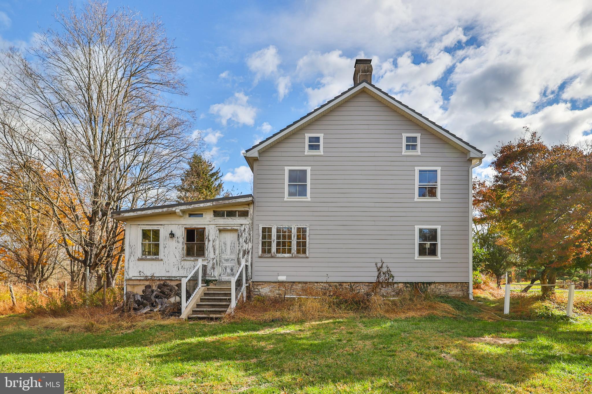 8659 Allemaengel Road Kempton, PA 19529 - Photo 69 of 71 a view of a yard in front of a house with plants and large tree