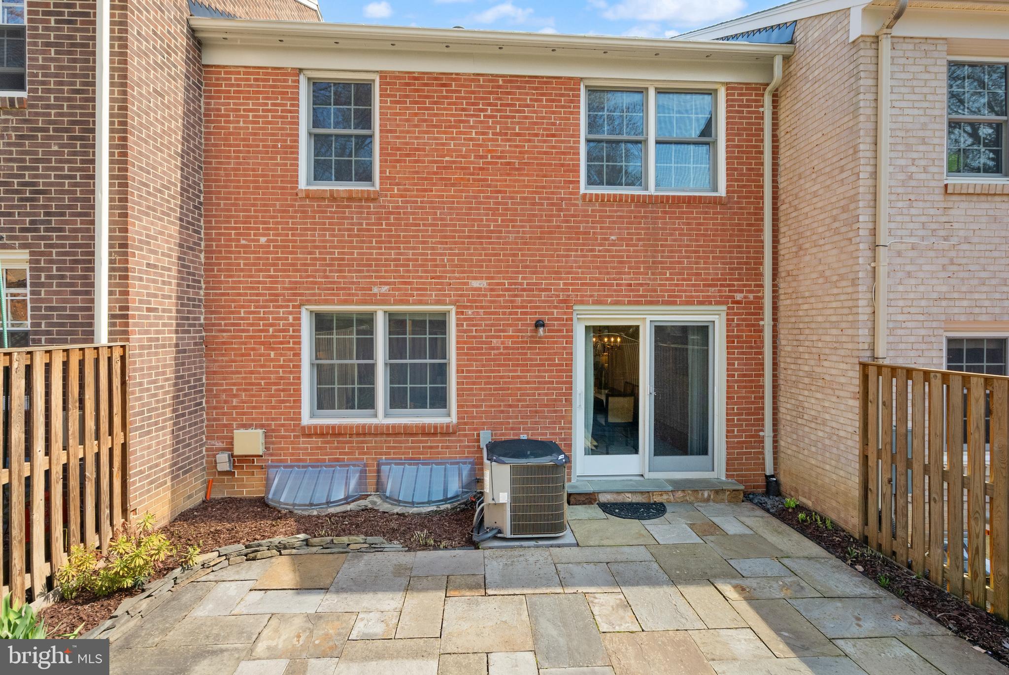 1838 Golf View Court Reston, VA 20190 - Photo 50 of 60 a view of a brick house with many windows