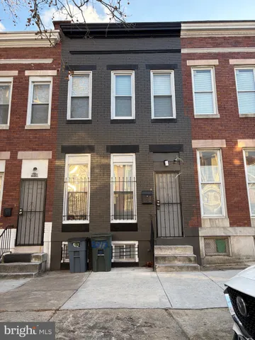a view of a brick building with many windows