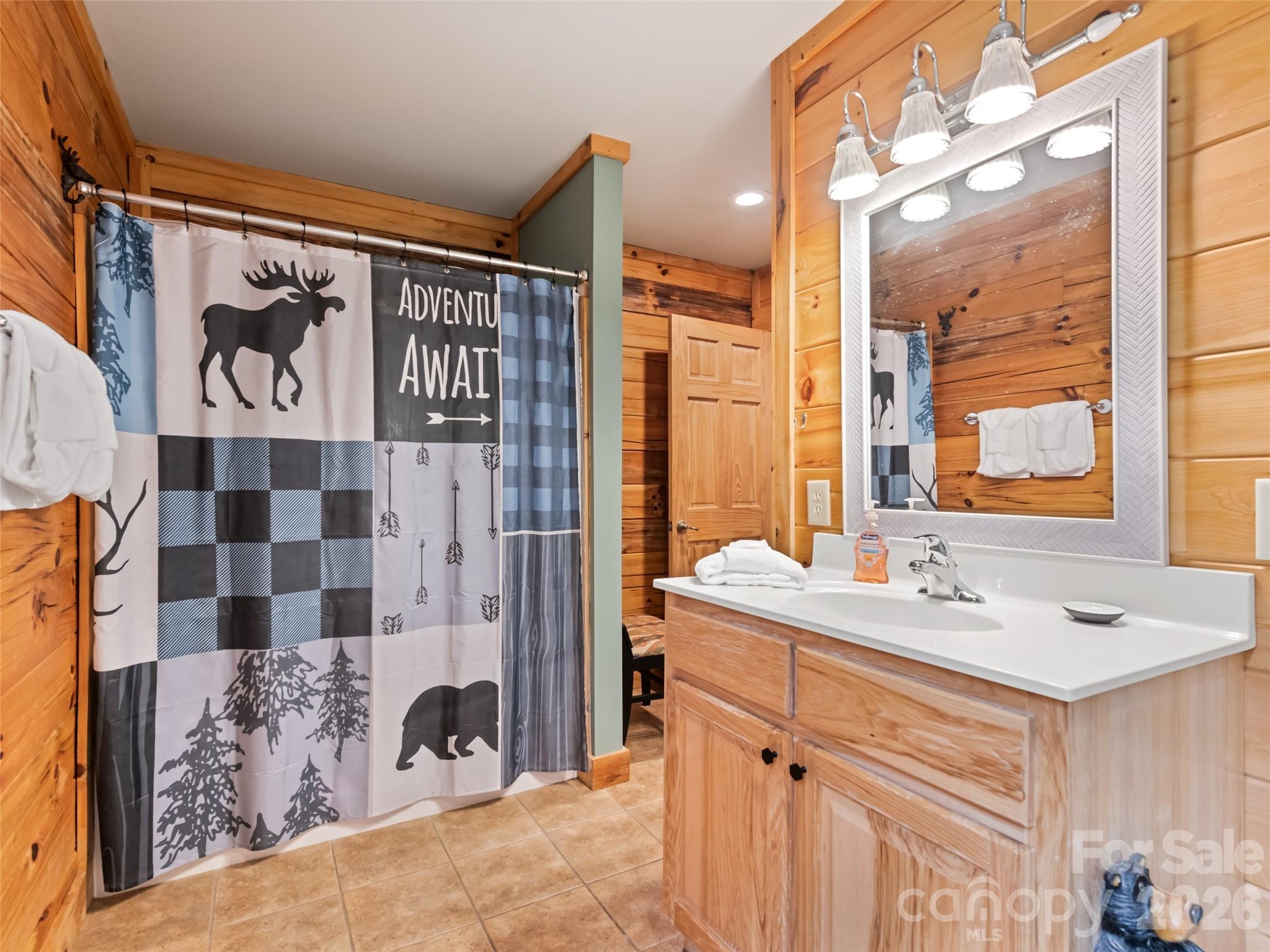 91 Copper Spur Road Maggie Valley, NC 28751 - Photo 13 of 29 a bathroom with a sink and a mirror