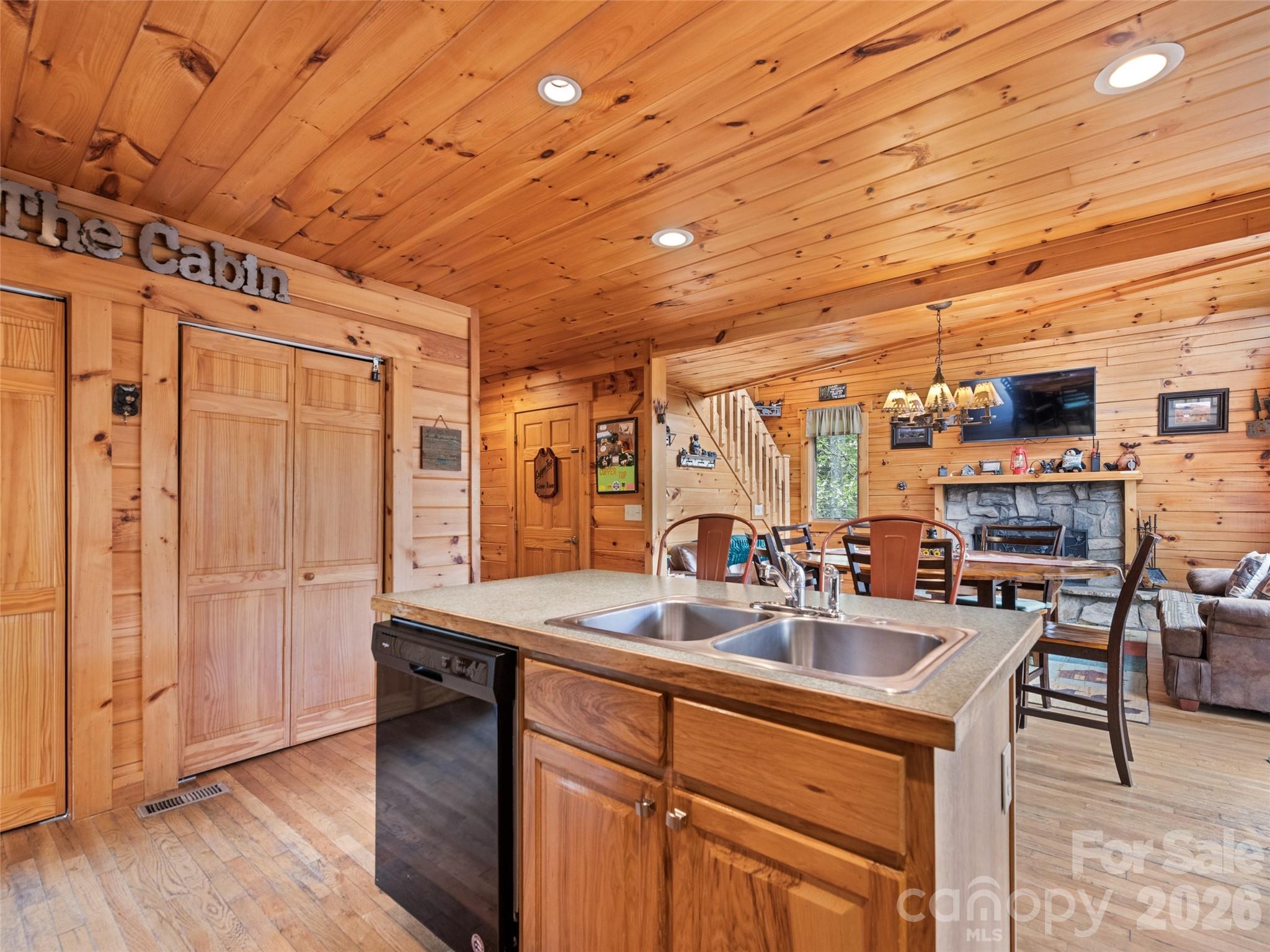 91 Copper Spur Road Maggie Valley, NC 28751 - Photo 6 of 29 a kitchen with stainless steel appliances a sink and cabinets