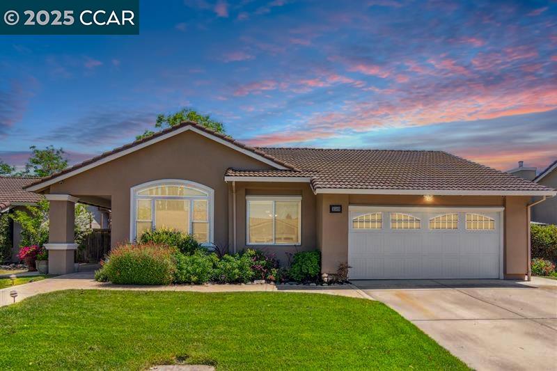 3509 Gulfstream Street Pleasanton, CA 94588 - Photo 1 of 1 a front view of a house with a yard and garage