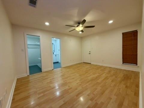 5045 Thunder Road Dallas, TX 75244 - Photo 7 of 28 a view of an empty room with a ceiling fan