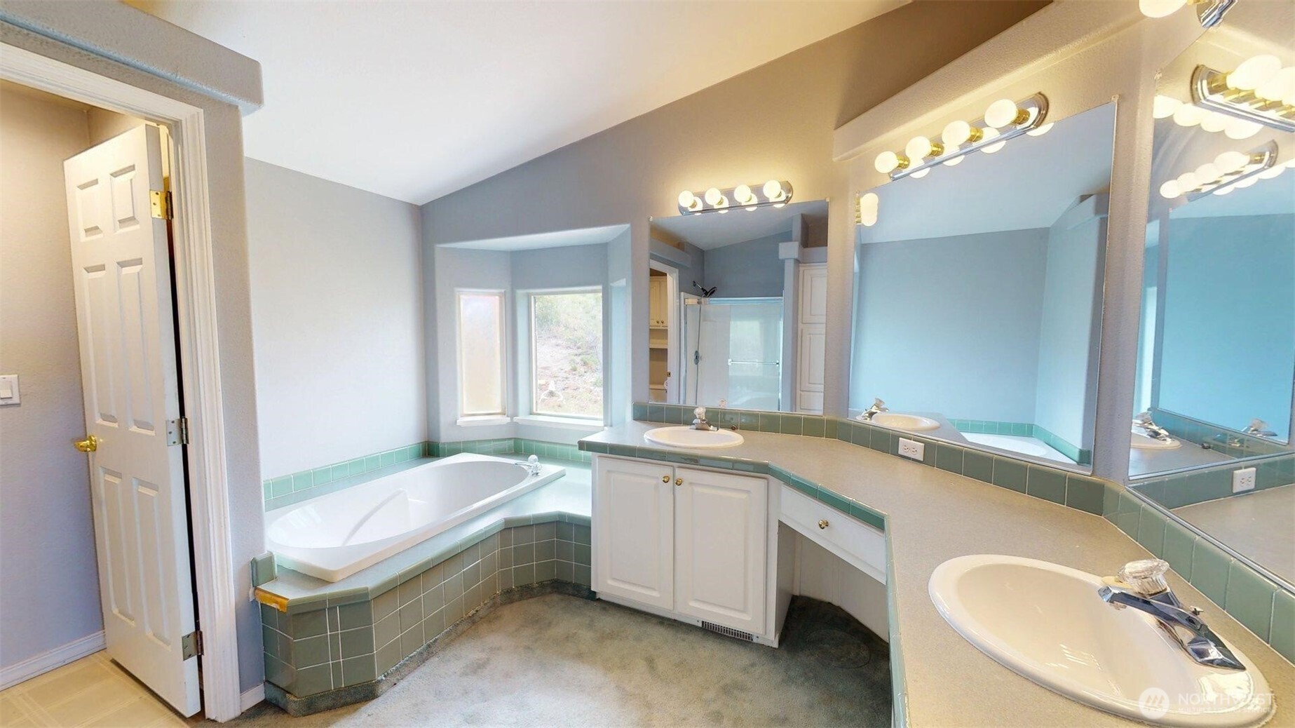 142 Fletcher Road Oroville, WA 98844 - Photo 17 of 26 a bathroom with a granite countertop sink and a mirror
