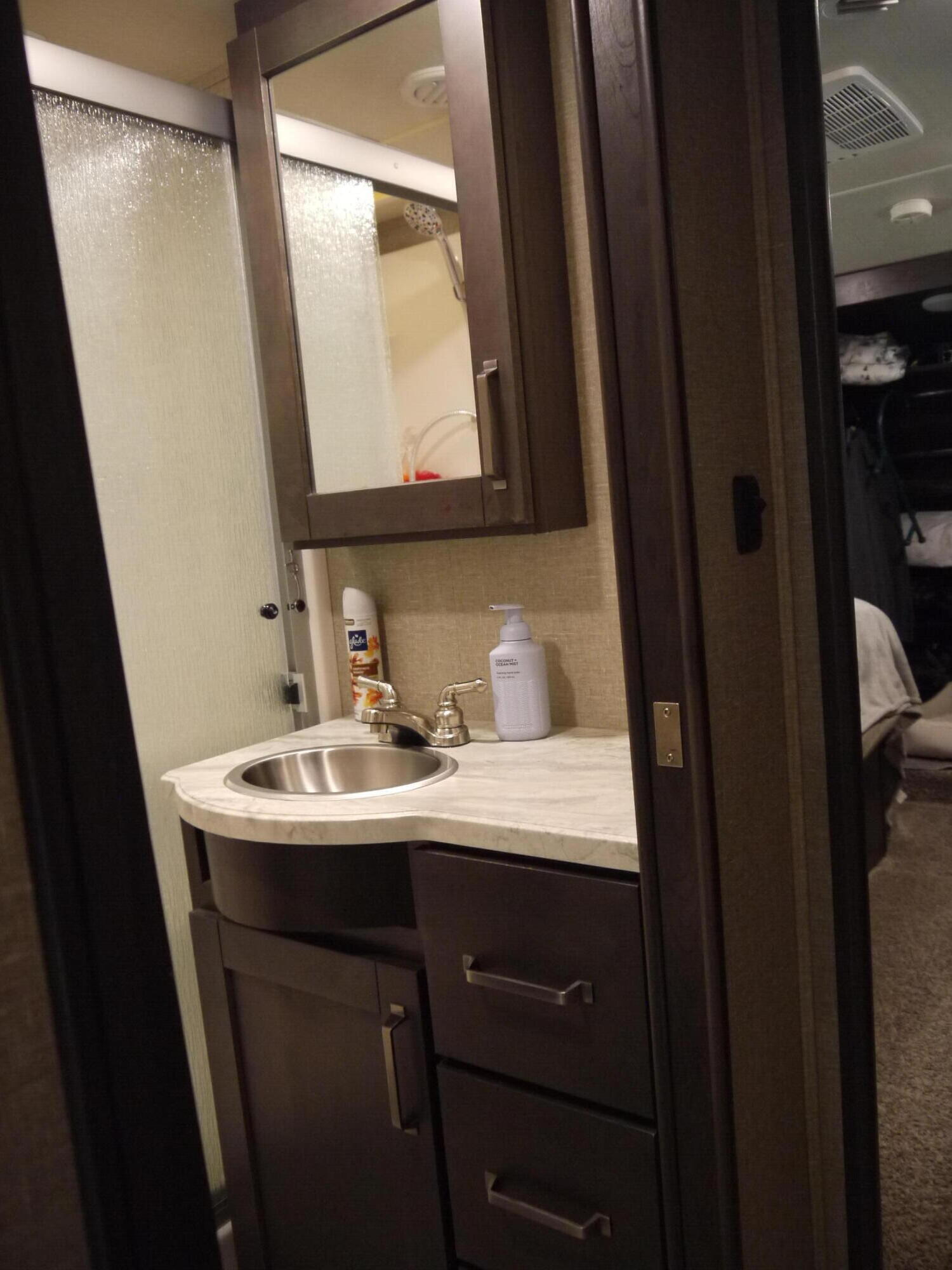 4449 Yellow Bluff Road Crestview, FL 32539 - Photo 36 of 42 a bathroom with a sink a mirror a vanity and a toilet