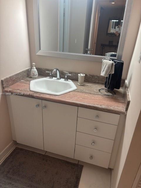 100 Lincoln Road, Unit 821 Miami Beach, FL 33139 - Photo 9 of 33 a bathroom with a granite countertop sink and a mirror