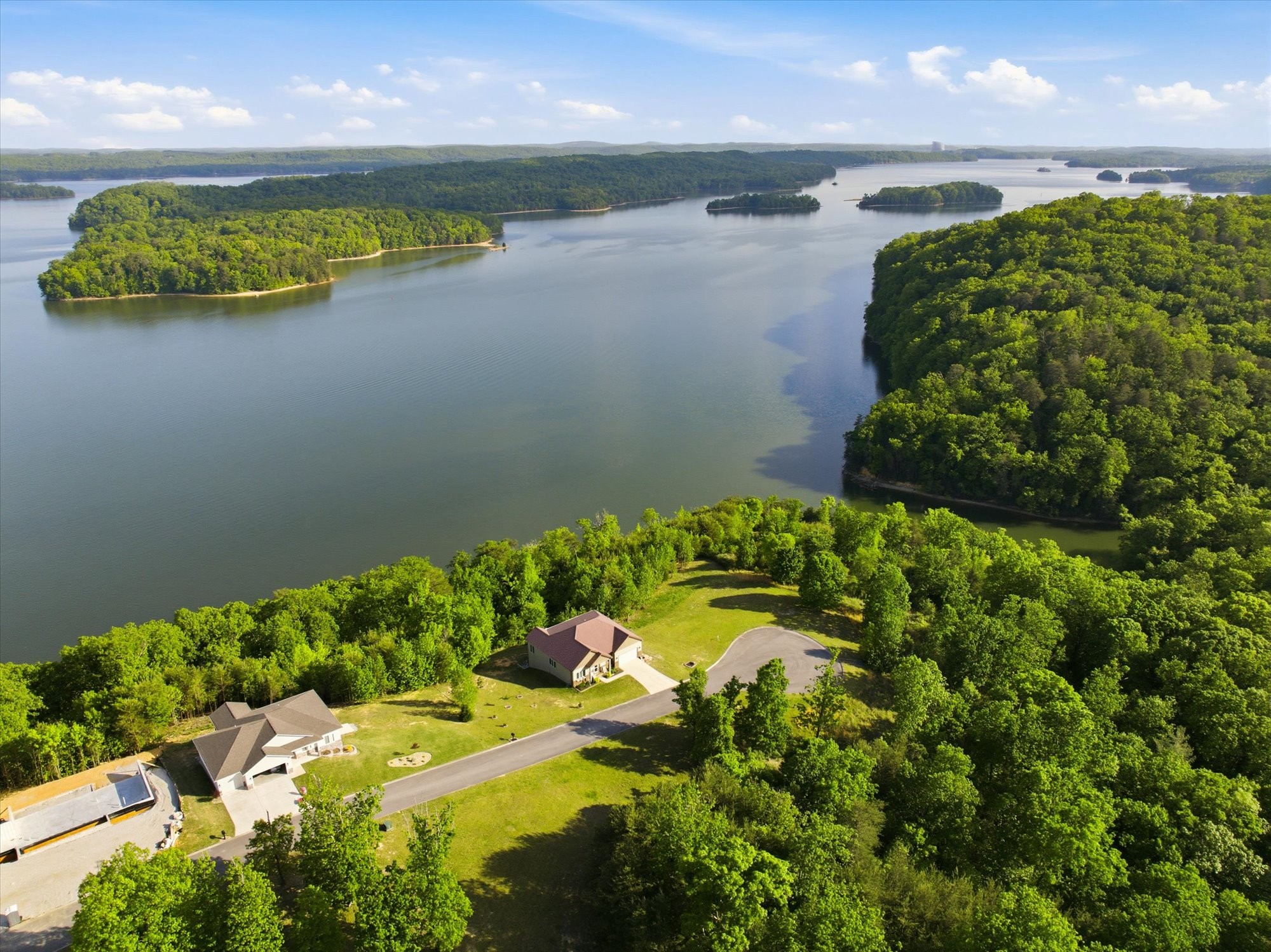 240 River Run Trail Spring City, TN 37381 - Photo 9 of 24 a view of a lake with a yard