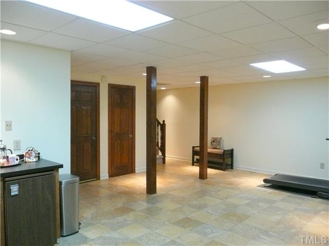 10300 Whitestone Road Raleigh, NC 27615 - Photo 18 of 25 Gorgeous tile floor in this finished basement bonus room.