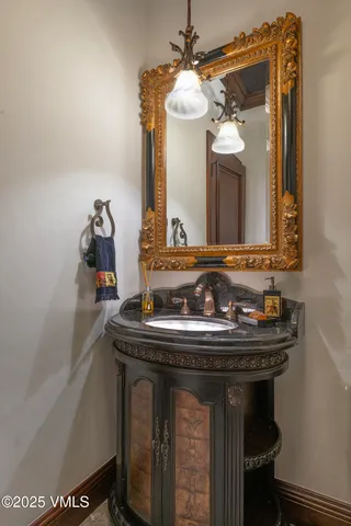 a view of a house with a yard and fountain in front of it
