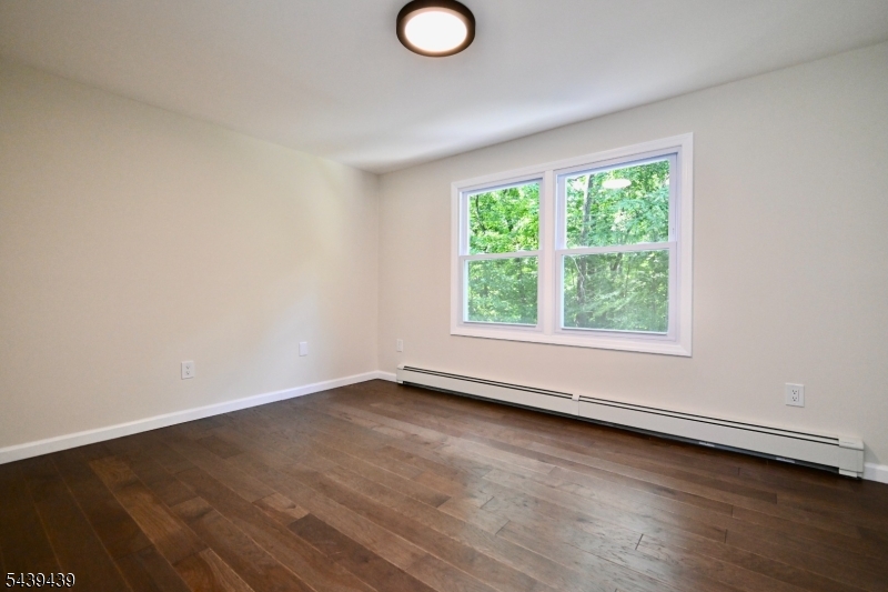 1 Appleseed Road Sussex, NJ 07461 - Photo 12 of 19 an empty room with wooden floor and windows
