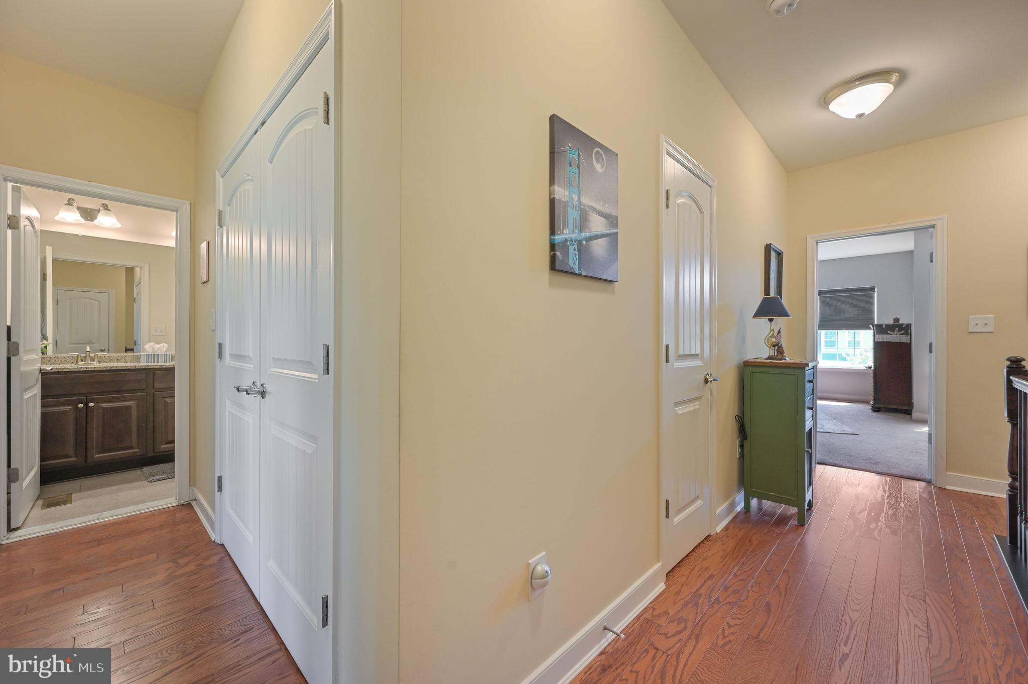275 Mingo Way Townsend, DE 19734 - Photo 17 of 23 a view of a hallway and a dining room with wooden floor