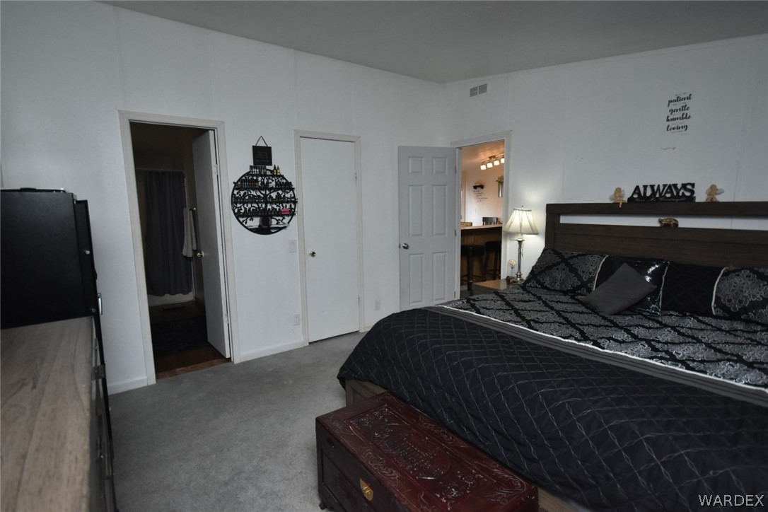3340 Houck Road Golden Valley, AZ 86413 - Photo 24 of 41 a bedroom with a bed and a television