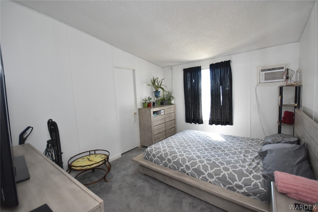3340 Houck Road Golden Valley, AZ 86413 - Photo 29 of 41 a bedroom with a bed and a couch