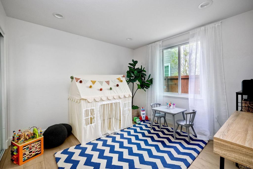 1054 Lighthouse Road Carlsbad, CA 92011 - Photo 14 of 44 a bedroom with furniture and a window