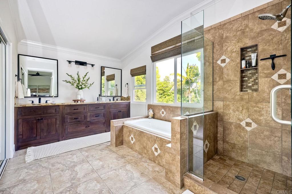 1054 Lighthouse Road Carlsbad, CA 92011 - Photo 21 of 44 a bathroom with a sink a vanity and a mirror