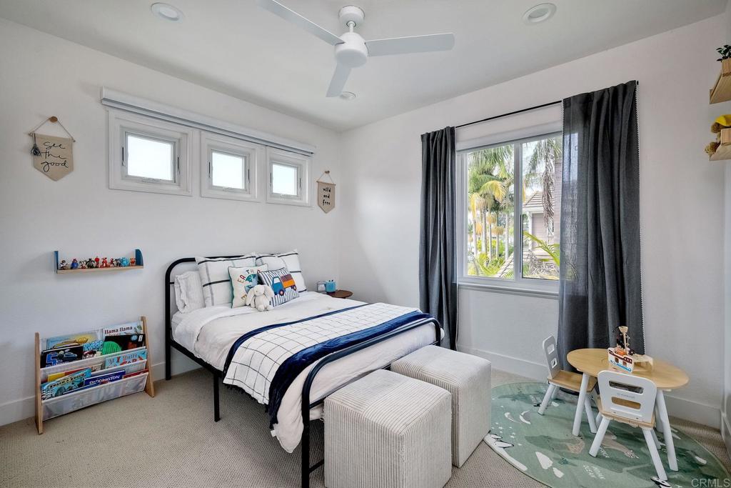 1054 Lighthouse Road Carlsbad, CA 92011 - Photo 26 of 44 a bedroom with a bed and a window