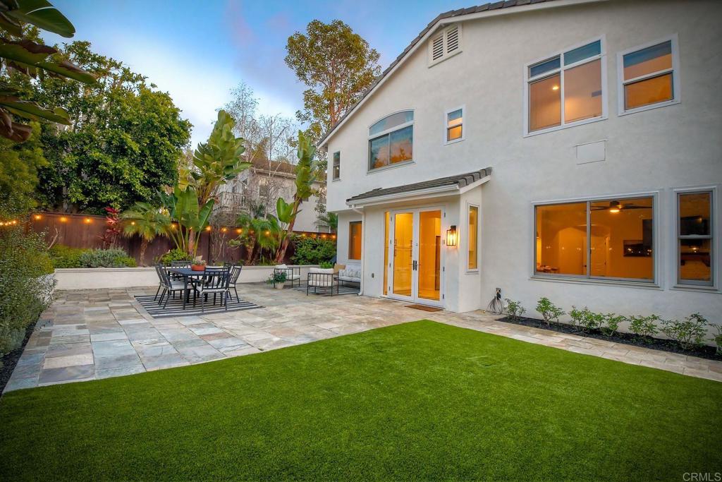 1054 Lighthouse Road Carlsbad, CA 92011 - Photo 30 of 44 a view of backyard of house with outdoor seating and green space
