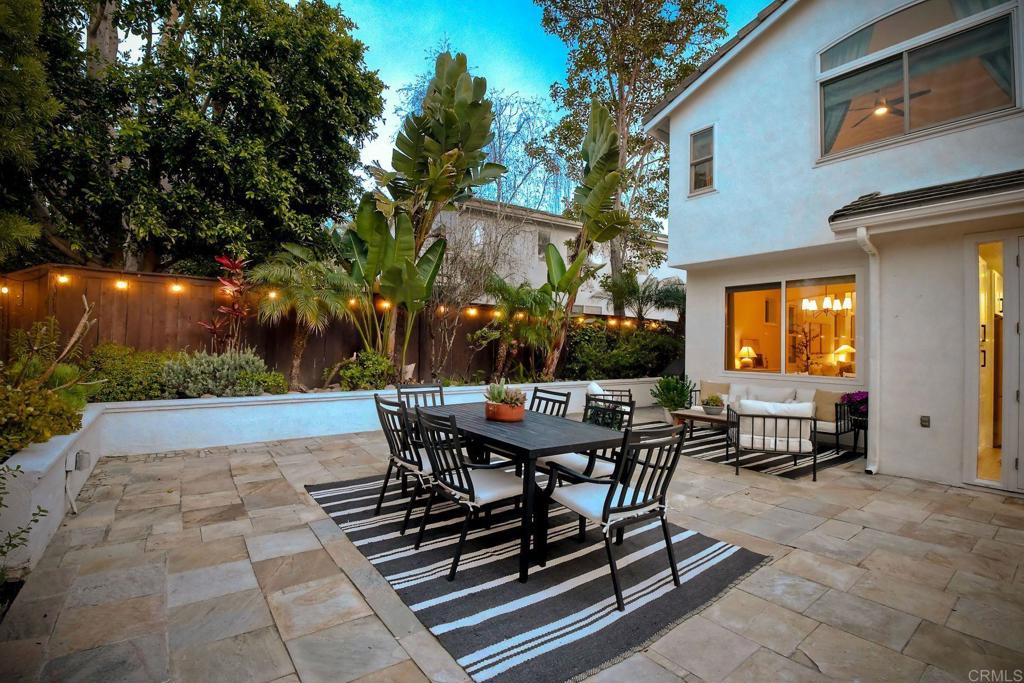 1054 Lighthouse Road Carlsbad, CA 92011 - Photo 31 of 44 a view of a patio with table and chairs and potted plants
