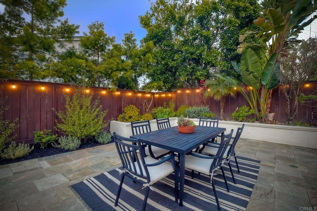 1054 Lighthouse Road Carlsbad, CA 92011 - Photo 32 of 44 a view of a table and chairs in patio