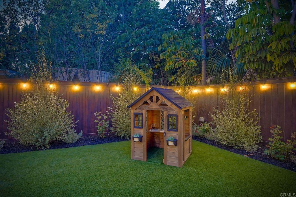 1054 Lighthouse Road Carlsbad, CA 92011 - Photo 34 of 44 a front view of a house with garden