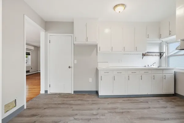 a view of cabinets with wooden floor