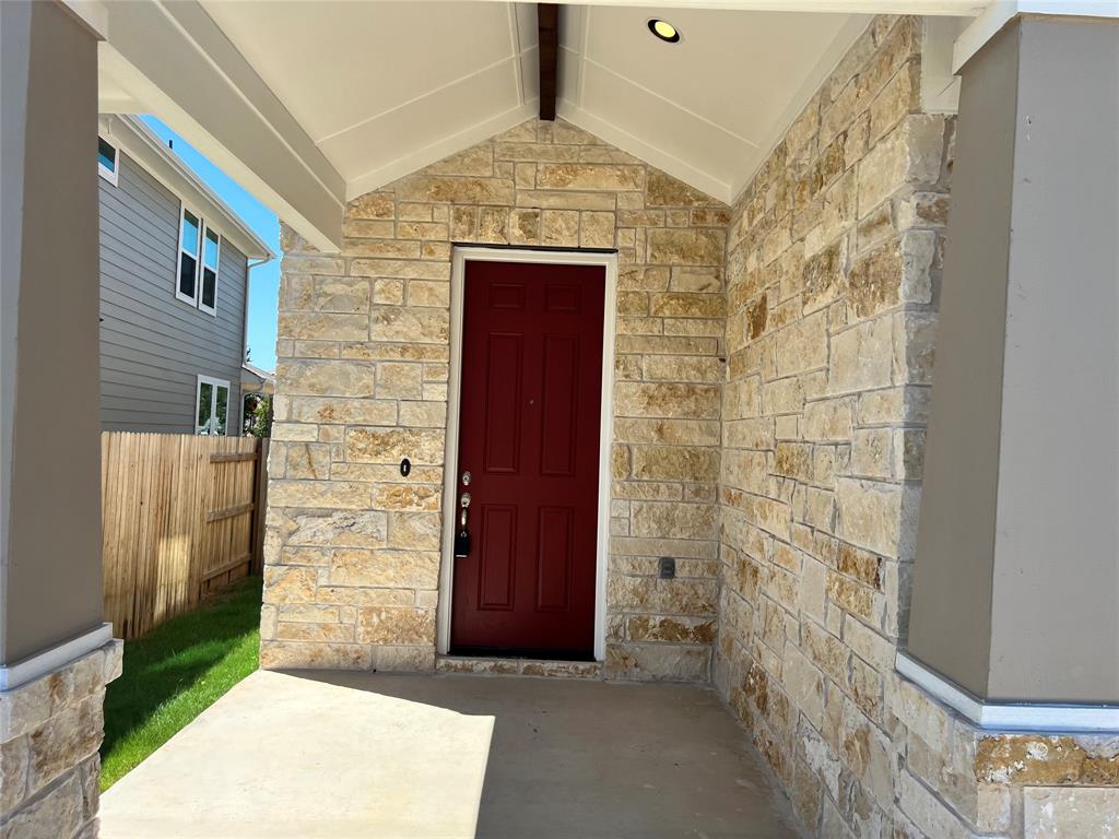128 Free Stone Drive Georgetown, TX 78628 - Photo 2 of 29 Stone veneer facade with a covered entry