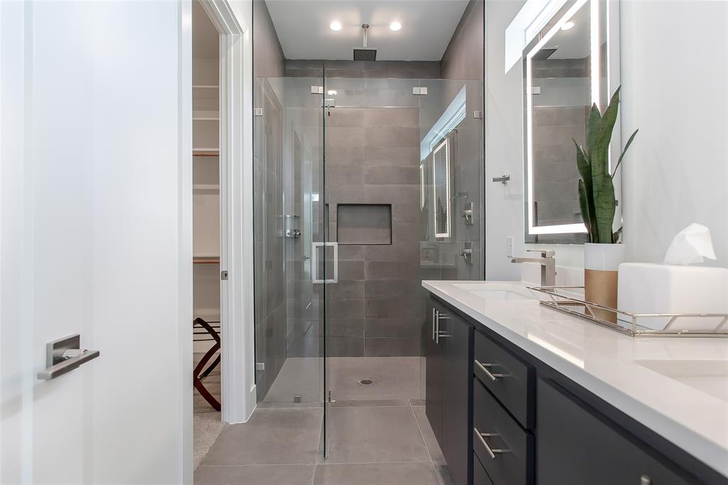 4425 Rusk Avenue Dallas, TX 75204 - Photo 11 of 19 a bathroom with a shower sink and mirror