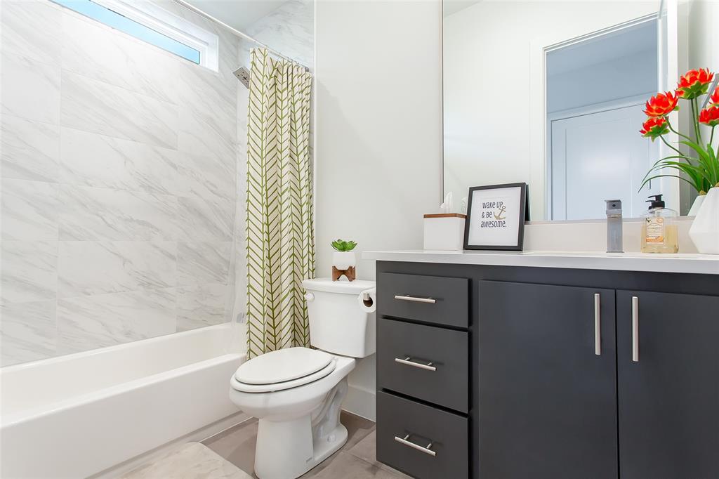 4425 Rusk Avenue Dallas, TX 75204 - Photo 13 of 19 a bathroom with a sink a toilet and shower