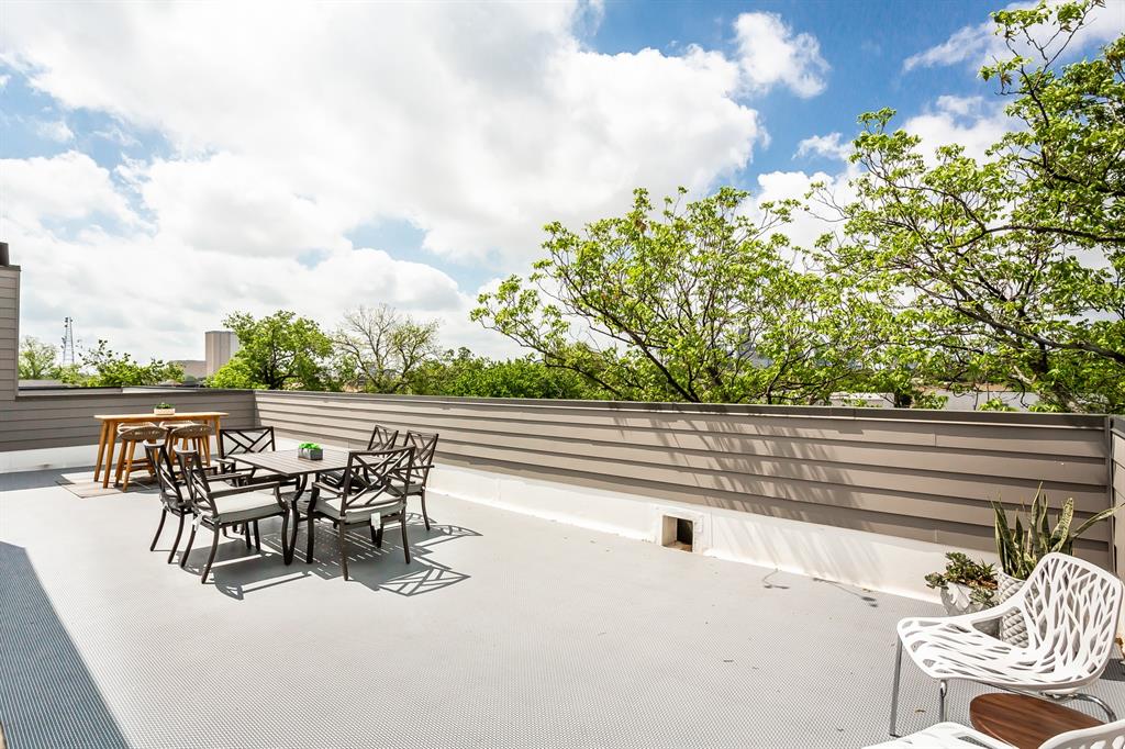 4425 Rusk Avenue Dallas, TX 75204 - Photo 18 of 19 a view of roof deck with table and chairs and potted plants