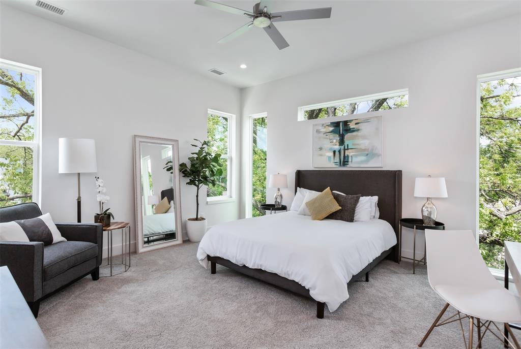 4425 Rusk Avenue Dallas, TX 75204 - Photo 9 of 19 a bedroom with a bed couch and windows