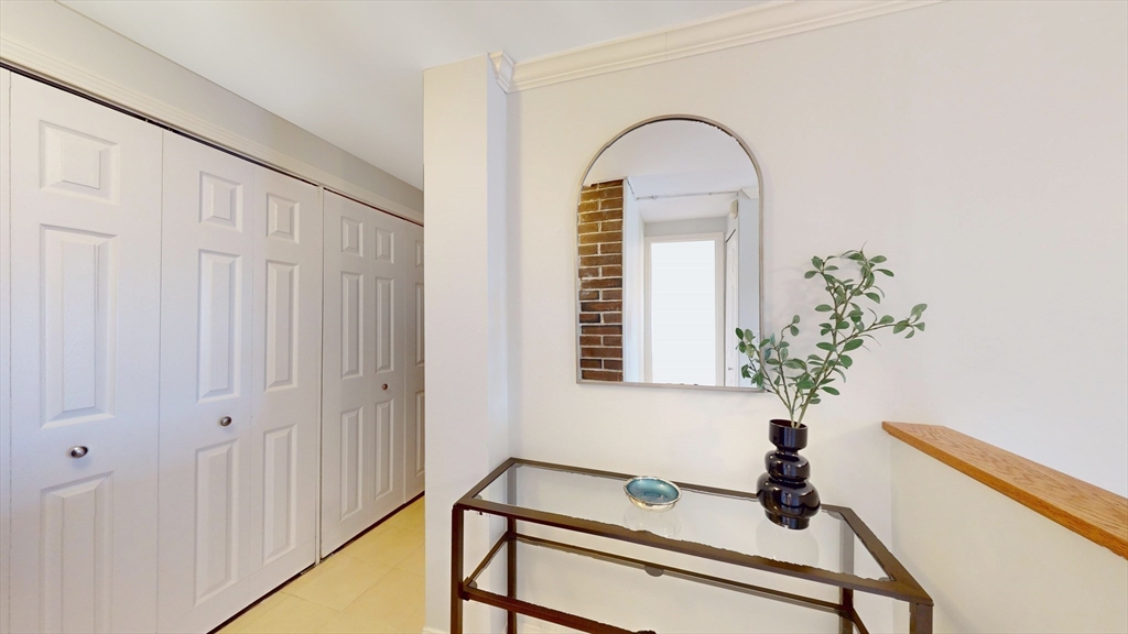 1856 Beacon Street, Unit 6F Brookline, MA 02445 - Photo 2 of 17 a view of entryway with a potted plant