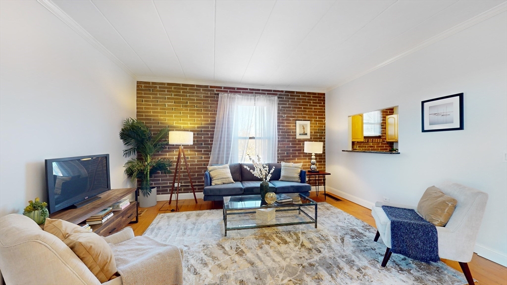 1856 Beacon Street, Unit 6F Brookline, MA 02445 - Photo 7 of 17 a living room with furniture and a window